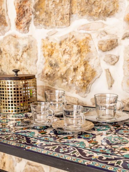 Luxury tea set with elegant glass cups on colorful tiles at Flora Valley Boutique Hotel, Ein Kerem, Jerusalem