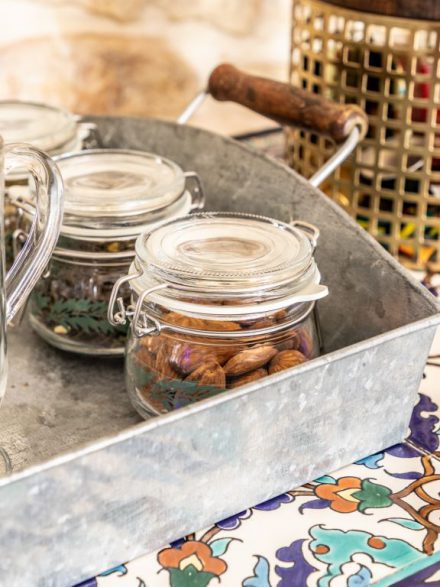Jars of dried fruits and spices in the boutique suite of Flora Valley Boutique Hotel, Ein Kerem, Jerusalem – natural treats for guests
